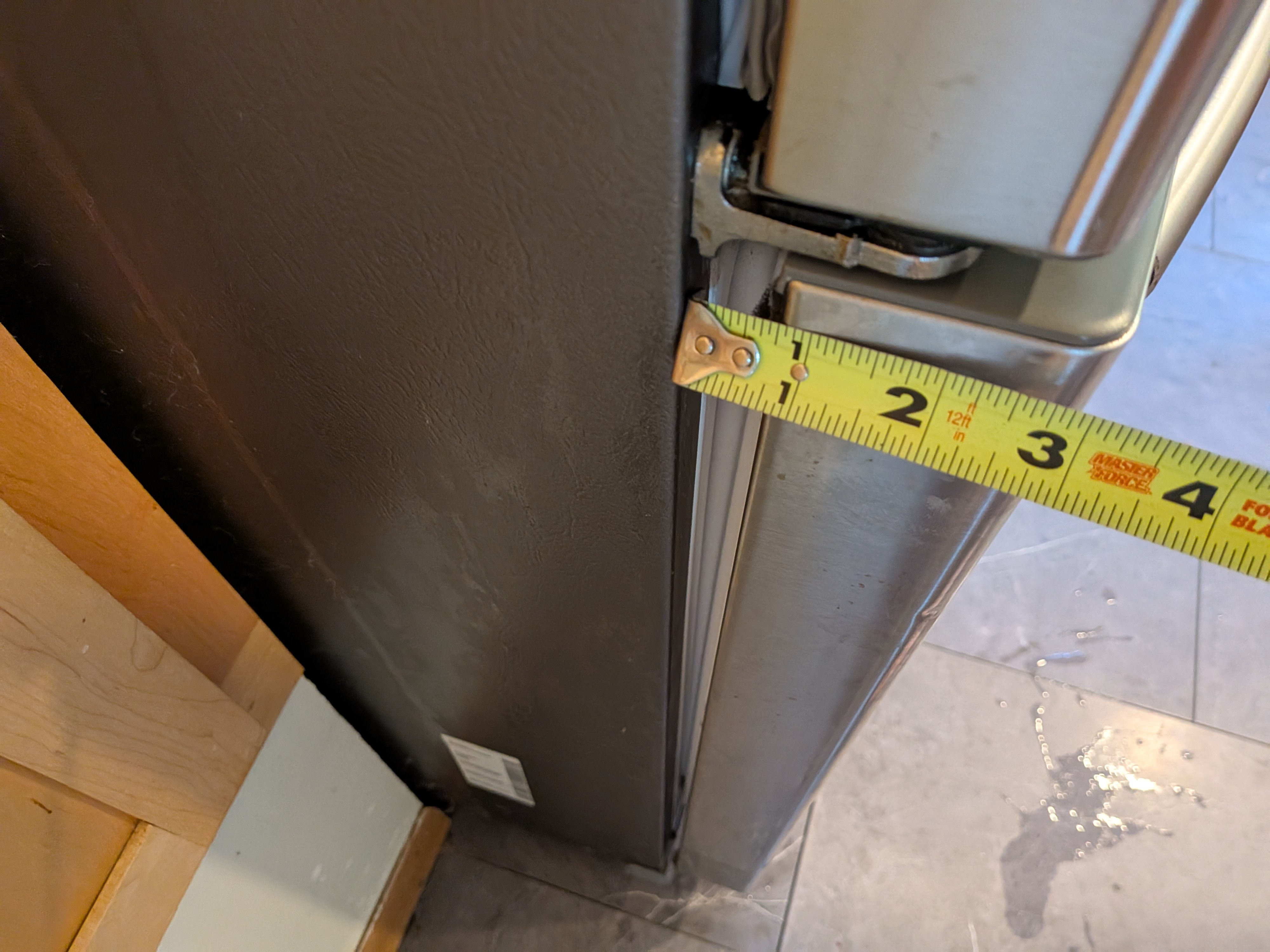 When I measured, it was a nearly 1/2" difference from the top to the bottom of the left side of the freezer drawer.
