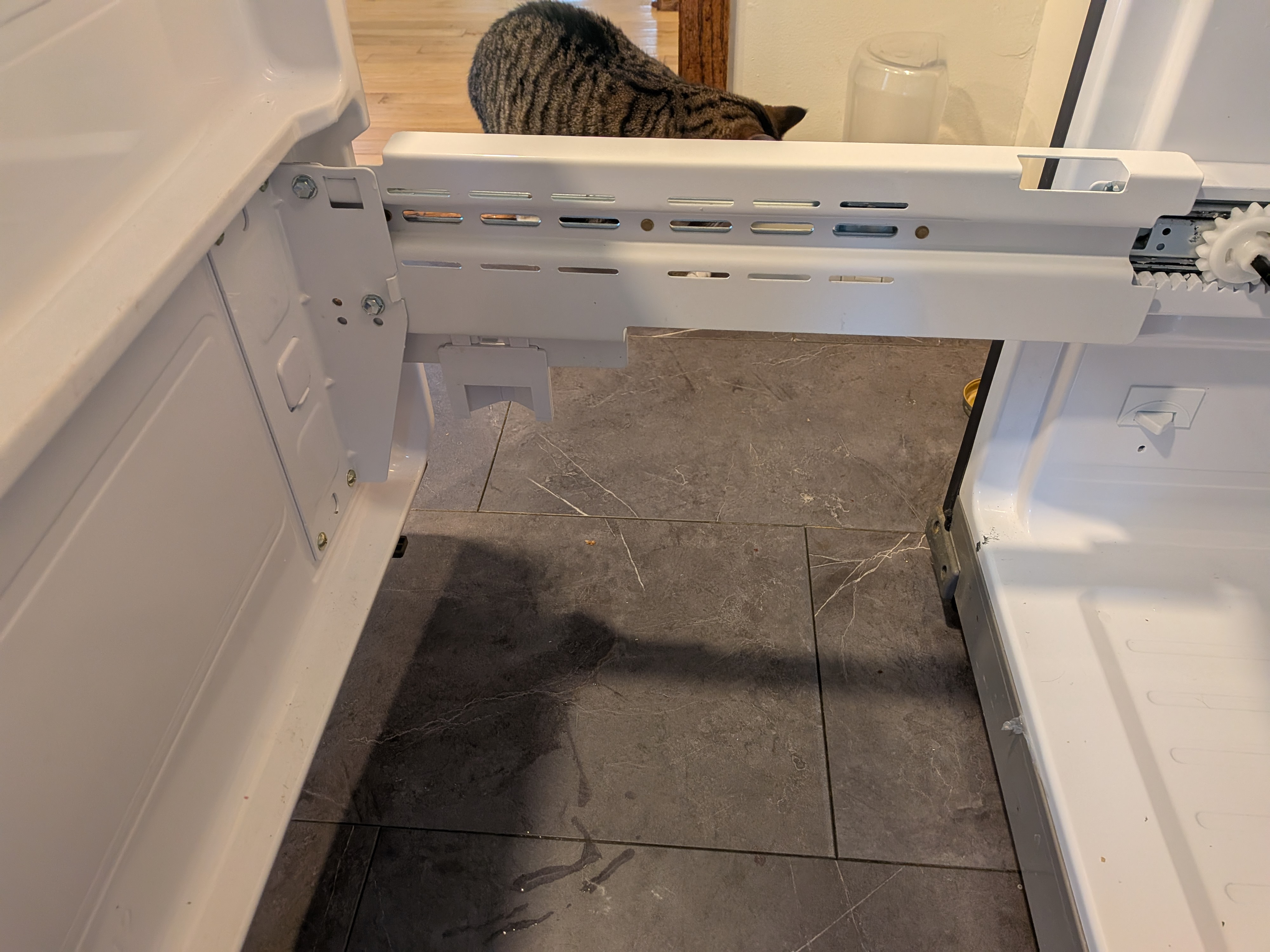 Mechanical slop in the rails that held the freezer door in place meant the door door wasn't plumb.