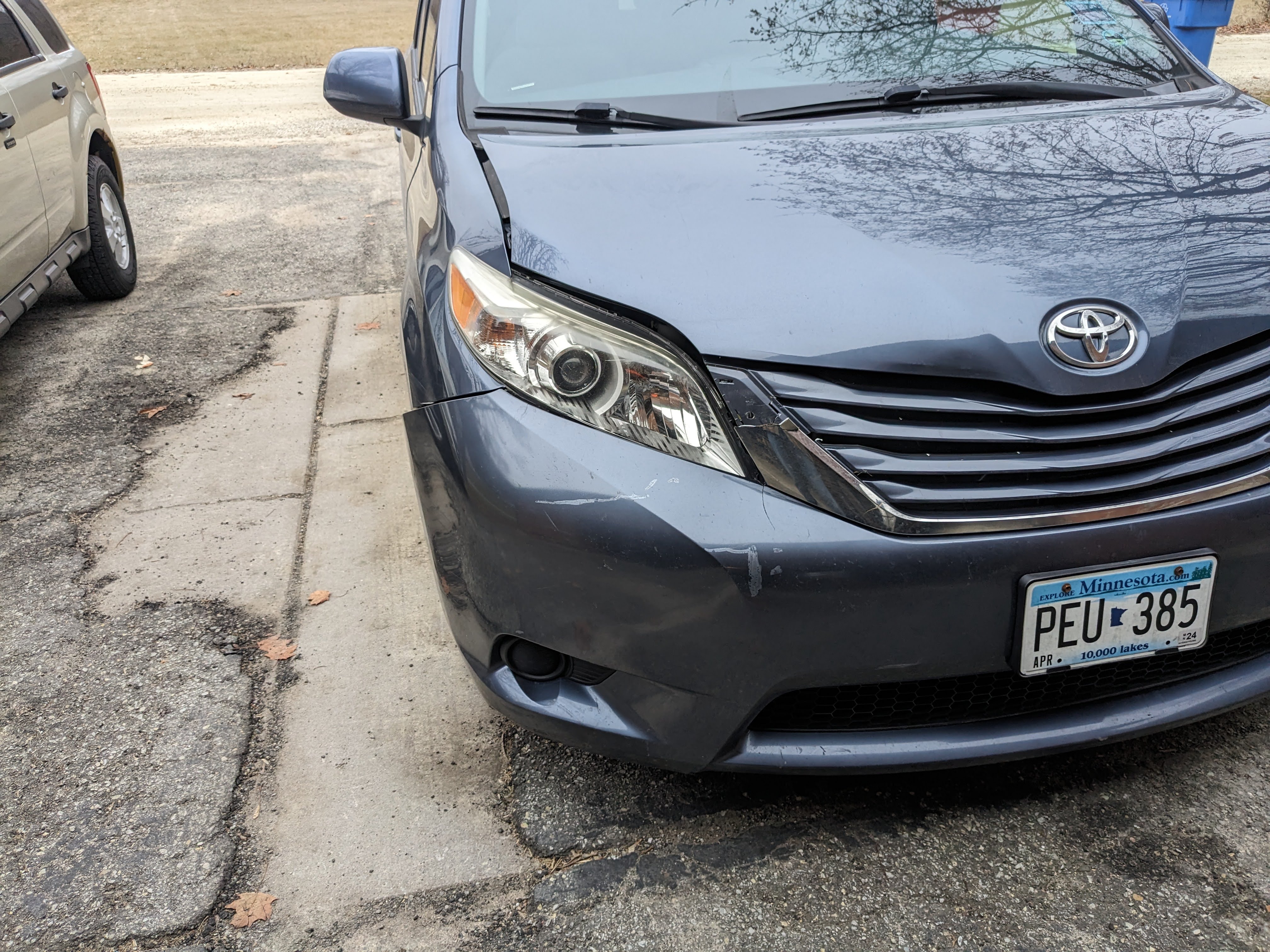 Picture of the damage done to a Toyota Sienna after hitting a deer.