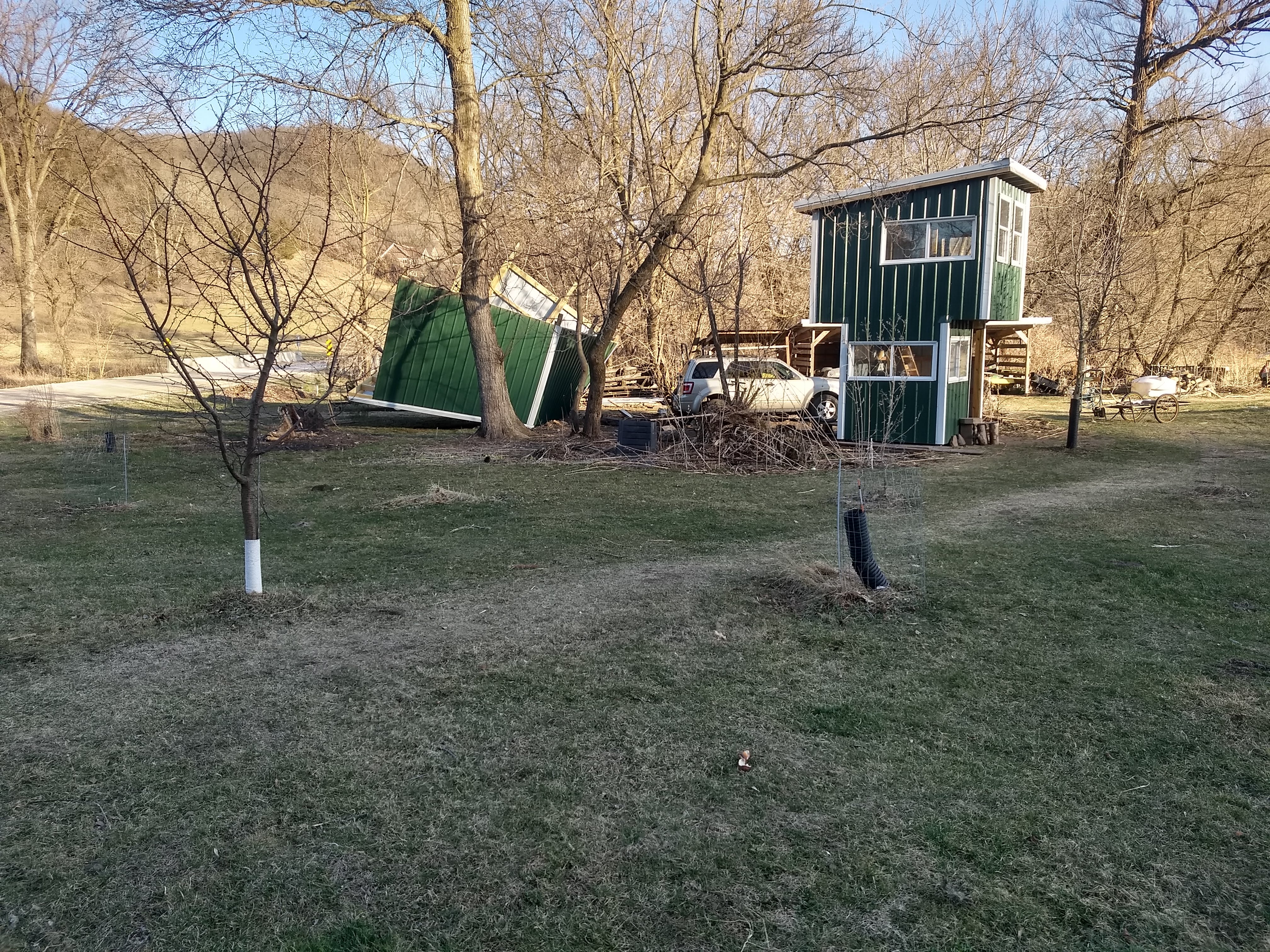 Picture of a woodshed that was overturned by the wind.