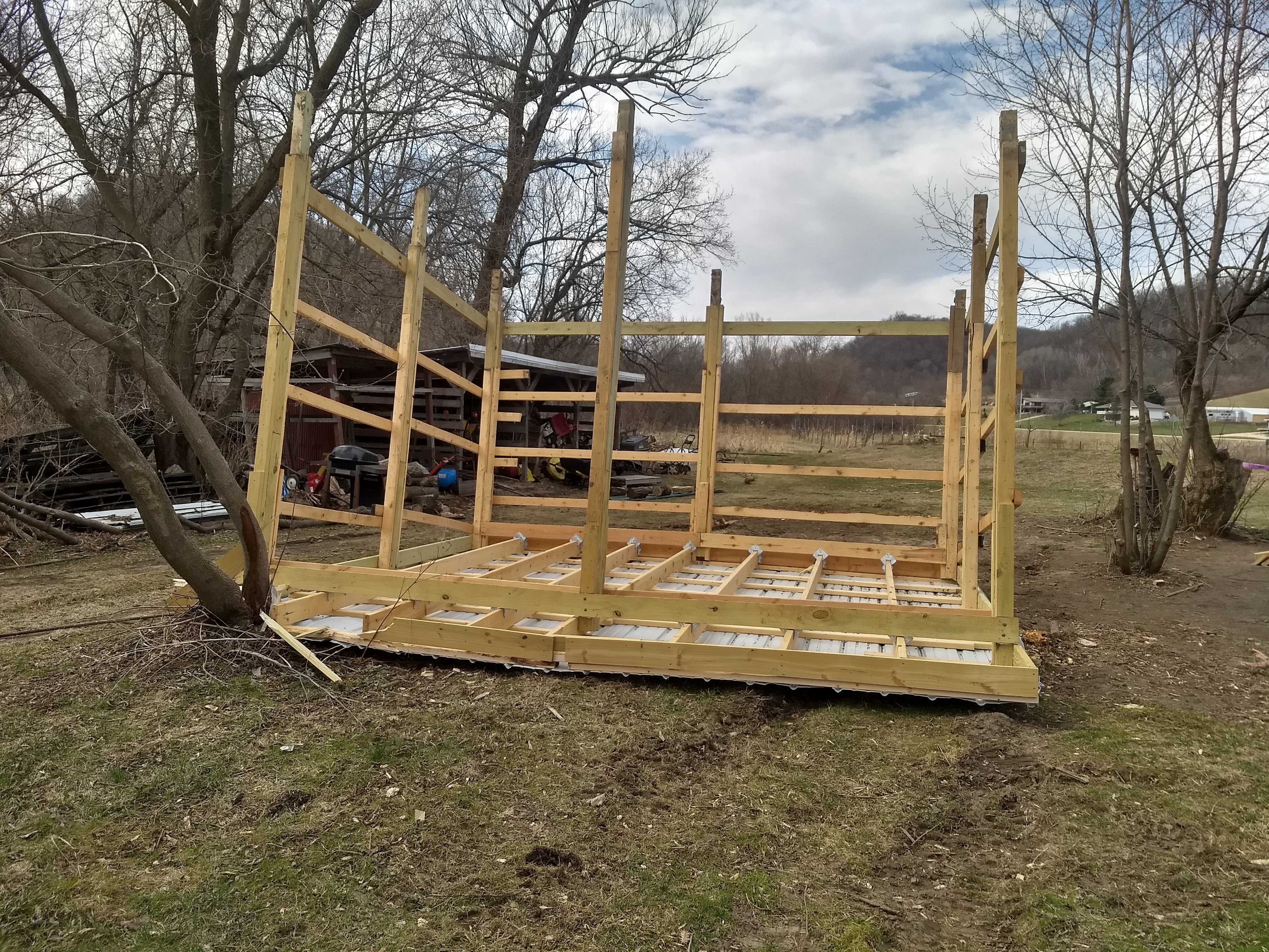 Picture of a woodshed that was overturned by the wind.