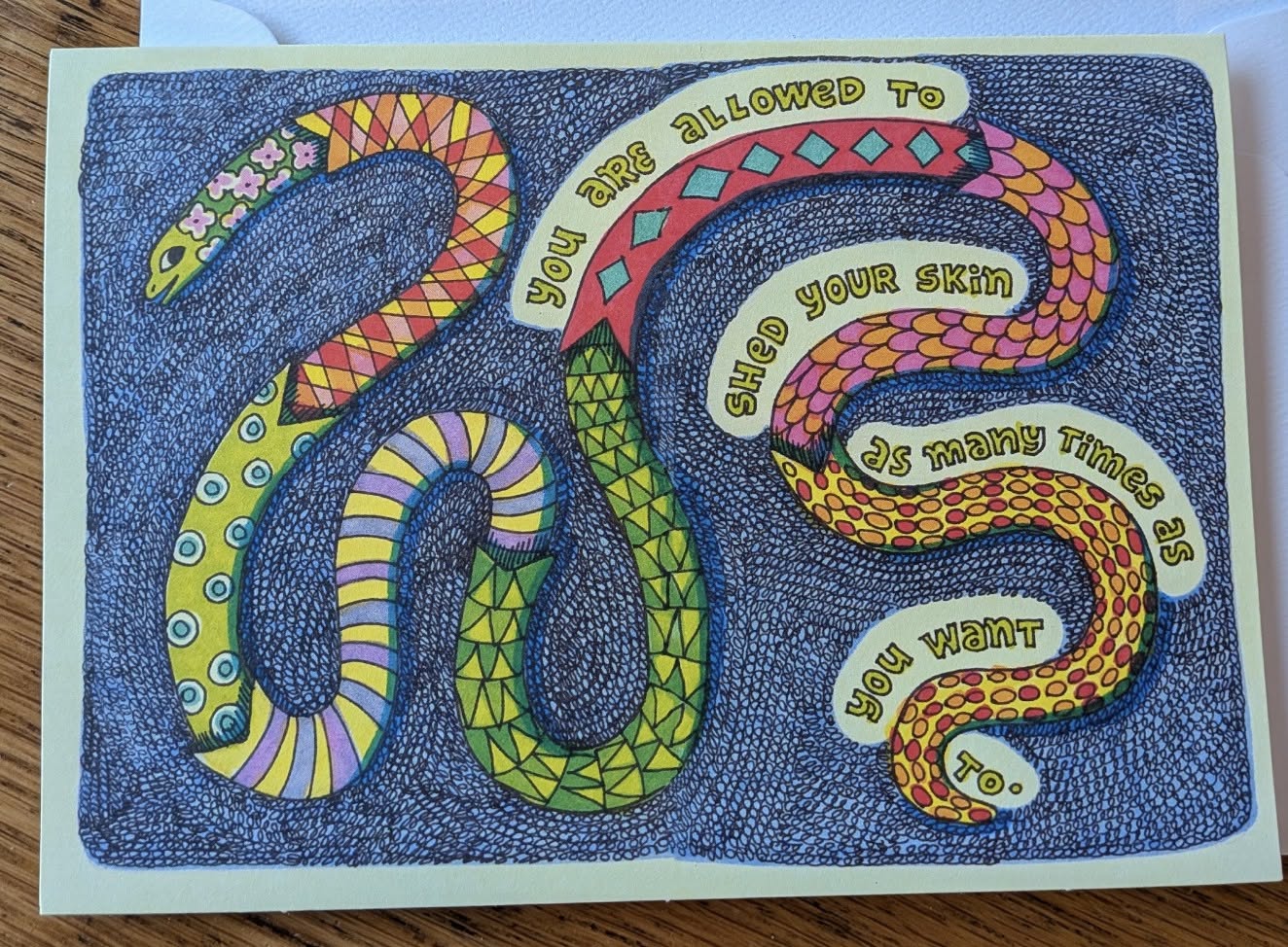 A cool postcard showing a snake shedding its skin